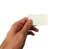 mano che tiene biglietto da visita in bianco isolato su sfondo bianco foto