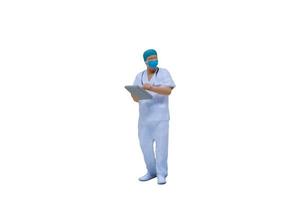 medici in miniatura con tute protettive e maschere su uno sfondo bianco foto