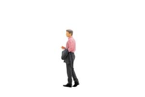 imprenditore in miniatura in piedi isolato su uno sfondo bianco foto