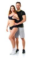 atletico uomo e donna dopo fitness esercizio con pollici su su il bianca foto