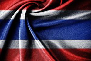 tailandese bandiera soffiaggio nel il vento con altamente dettagliato tessuto struttura design. e buio realistico Tailandia bandiera agitando su vento foto