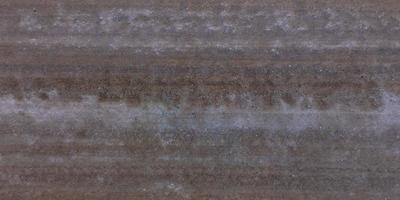 superiore Visualizza di superficie di ghiaia strada fatto di piccolo pietre e sabbia con tracce di auto pneumatici foto