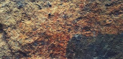 Marrone ruvido pietra sfondo. difficile superficie e grunge sfondo. soffitta pavimento e strutturato di roccia foto