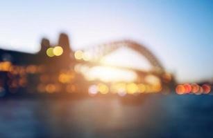 il astratto sfocato sfondo di sydney porto ponte durante il tramonto. foto