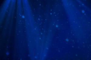 blu sfocato palcoscenico sfondo con stelle e fiocchi di neve. foto