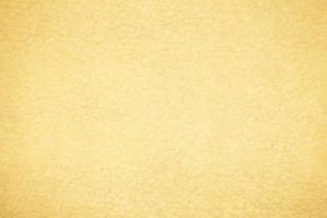 giallo pecora pelliccia con un' struttura di fibre. modello morbido tela per vario scopi foto
