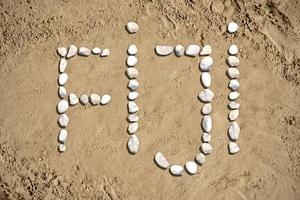 fiji - parola fatto con pietre su sabbia foto