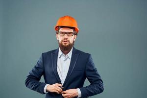 attività commerciale uomo nel completo da uomo arancia difficile cappello industria ufficiale professionale foto