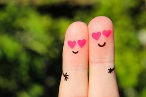 dito arte di un' contento coppia. un' uomo e un' donna abbraccio con rosa cuori nel il occhi. foto