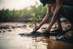 ripristino il costa Comunità Fidanzamento nel piantare mangrovie per ambiente conservazione e habitat restauro su terra giorno, promozione sostenibilità. terra giorno foto