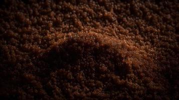 buio cioccolato Marrone simile allo zucchero granuloso struttura sfondo foto