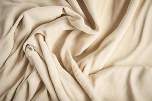 beige intrecciata tessile drappo sfondo. agitando stoffa tessuto tela foto