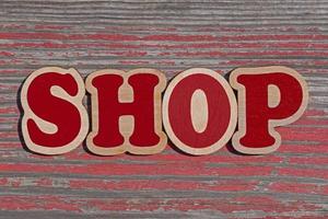 parola negozio fatto di di legno lettere su anziano di legno tavola foto
