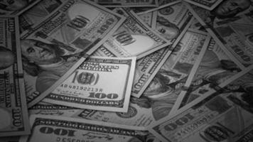 nero e bianca sfondo di noi moneta banconote finanziario concetto i soldi sfondo centinaio dollaro fatture foto