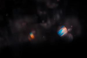 lente bagliore e leggero perdita foschia struttura su un' nero sfondo. foto