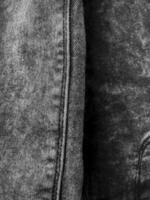 grigio jeans struttura, verticale foto, decorativo per sfondo. popolare Abiti, design elemento, cucitura, occhiali da sole di grigio colore. fazzoletto di carta Prodotto, bellezza e moda foto