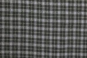struttura di scacchi grigio, bianca lana vergine. scacchi leggero grigio strutturato tessuto sfondo avvicinamento foto