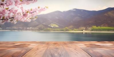 vuoto di legno tavolo con primavera ciliegia fiorire decorazione. sfocato bokeh montagna e lago Visualizza sfondo. copia spazio. per Prodotto Schermo. modelli, media, stampa, eccetera., creare ai foto