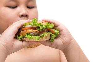 Maiale Hamburger su obeso Grasso ragazzo mano sfondo isolato foto