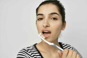 donna igiene denti pulizia cura Salute isolato sfondo foto