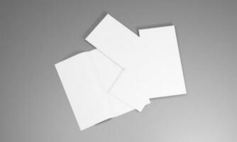 vuoto ritratto carta modello. opuscolo rivista, bianca variabile sfondo carta isolato su grigio bene per il tuo attività commerciale modello foto