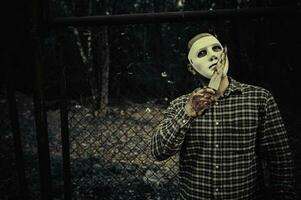 asiatico bello uomo indossare bianca maschera, assassino maschio concetto, halloween Festival manifesto foto