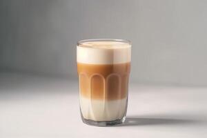 un' latte macchiato macchiato nel un' Glas su un' bianca sfondo creato con generativo ai tecnologia. foto