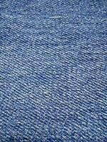 struttura di blu jeans, dettagli avvicinamento di il denim. foto