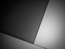astratto pendenza metallo sfondo buio con carbonio fibra struttura foto