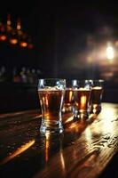 freddo birra o Whisky bicchieri con condensazione su di legno tavolo. sfocato interno di pub a il sfondo. generativo ai. foto