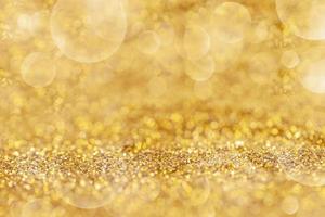 polvere d'oro elegante con bokeh astratto o texture di sfondo