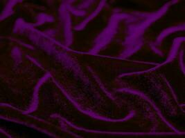 viola velluto tessuto struttura Usato come sfondo. vuoto viola tessuto sfondo di morbido e liscio tessile Materiale. Là è spazio per testo. foto