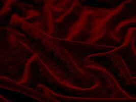 rosso velluto tessuto struttura Usato come sfondo. vuoto rosso tessuto sfondo di morbido e liscio tessile Materiale. Là è spazio per testo.. foto