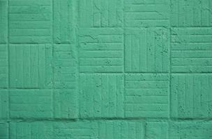 parete dipinta di verde decorativa con trama di sfondo quadrato e strisce