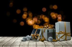 Natale regali con nastro su buio di legno sfondo nel Vintage ▾ stile foto