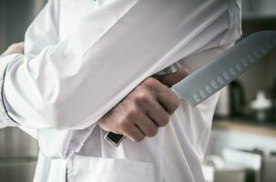 cucina capocuoco con coltello foto