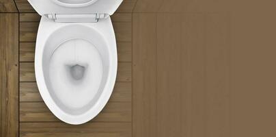 superiore Visualizza. di gabinetto ciotola nel bagno con di legno pavimento foto
