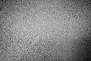 fondo bianco e nero di struttura della superficie del muro di cemento dello stucco foto