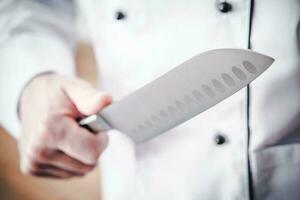 cucina capocuoco con coltello foto