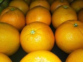 gruppo di arance frutta o mandarino foto