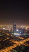 abbagliante notte città tiro di riyadh mostrando orizzonte punti di riferimento, ufficio e Residenziale edifici nel Sud arabia. generativo ai tecnologia. foto