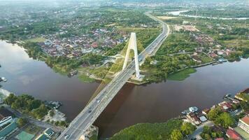 aereo Visualizza di siak ponte iv sopra siak fiume nel pekanbaru superiore Visualizza. pekanbaru, Indonesia, gennaio 25, 2023 foto