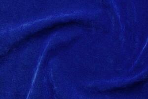 blu velluto tessuto struttura Usato come sfondo. blu tessuto sfondo di morbido e liscio tessile Materiale. Là è spazio per testo. foto