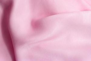 trama di materiale setoso rosa sfondo di seta rosa modello