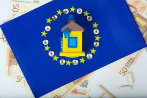 europeo bandiera, casa e valuta.sfondo foto