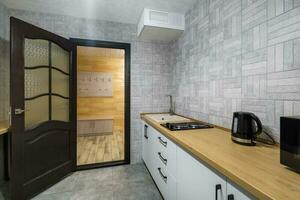 interno di moderno lusso cucina nel studio appartamenti con credenza foto