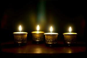 un' gruppo di illuminato candele seduta su superiore di un' tavolo. ai generato foto