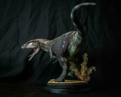 carcharadontosauro dinosauro nel il buio foto