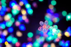 colorato luci bokeh a partire dal decorativo luminoso fiori ghirlande a vacanza, multicolore luci foto