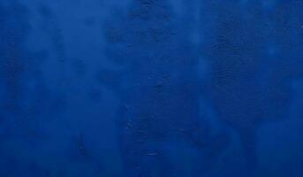 bellissimo astratto grunge stucco parete. buio blu sfondo foto